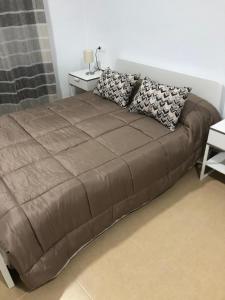 Una cama o camas en una habitación de Apartamento Paraíso