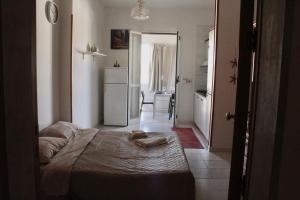 Ένα ή περισσότερα κρεβάτια σε δωμάτιο στο Baia Verde Casa di Fatima