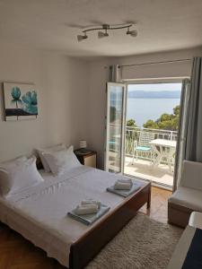 Postel nebo postele na pokoji v ubytování Apartments Žara