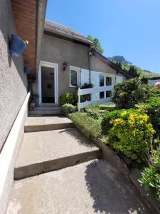 a house with a pathway leading to the front door at gite eslias in Viella