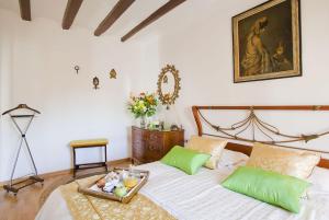 a bedroom with a bed with a tray of fruit on it at Apartment Eixample Comfort in Barcelona