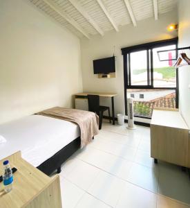 Postel nebo postele na pokoji v ubytování Ayenda 1224 Pixel House