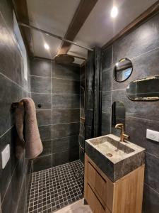 a bathroom with a sink and a shower at Mare è rocca in Bonifacio