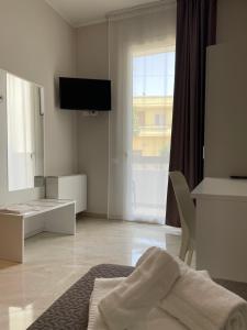 TV a/nebo společenská místnost v ubytování Karpignàna Hotel