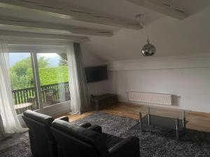 a living room with a couch and a table at Apartment Ivana B in Lesce