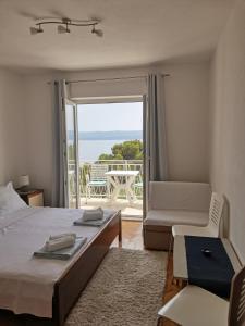Postel nebo postele na pokoji v ubytování Apartments Žara