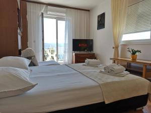 Postel nebo postele na pokoji v ubytování Apartments Žara