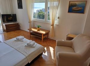 Postel nebo postele na pokoji v ubytování Apartments Žara