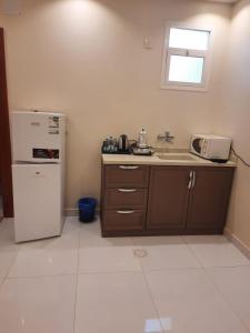 Kuchyň nebo kuchyňský kout v ubytování المهيدب للشقق المخدومة - اقتصادى