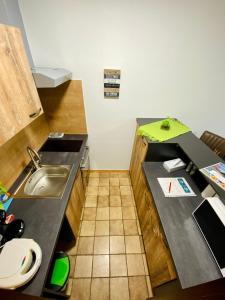 a small kitchen with a sink and a counter at Apartment Dachstein nahe Zentrum in Bad Ischl