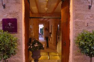 a hallway with a person walking into a building at Ca´n Pere in Alcudia