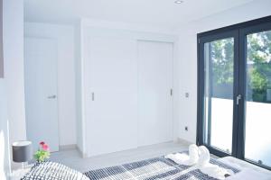 A bed or beds in a room at Villa Can SeQuet (Playa de Muro)