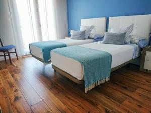 A bed or beds in a room at Apartamento Casa A Braña