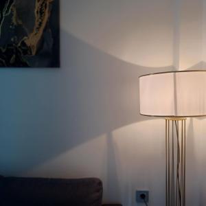 a living room with a lamp and a couch at Ponti Bay Apartments in Vasiliki