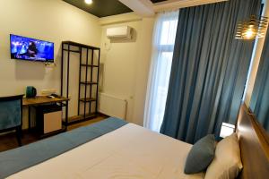 TV a/nebo společenská místnost v ubytování Hill Hotel