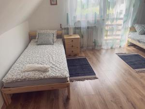 Posteľ alebo postele v izbe v ubytovaní Probarski Zakątek