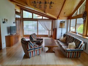 a living room with two chairs and a table at Ferienhaus Reiter in Schladming