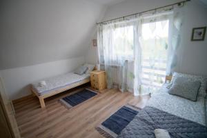 Posteľ alebo postele v izbe v ubytovaní Probarski Zakątek