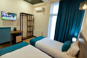 Postel nebo postele na pokoji v ubytování Hill Hotel