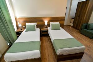 Postel nebo postele na pokoji v ubytování Hill Hotel