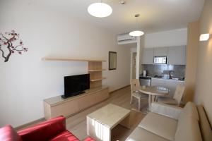 TV a/nebo společenská místnost v ubytování Nest 1 Hotel