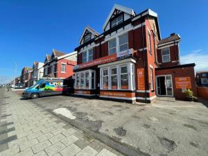 a van parked in front of a brick building at The Norwood Hotel For Groups-The Party Weekender! in Blackpool