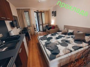 a bedroom with a large bed in a room at Borovets Villa Park studio in Borovets