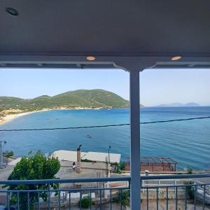 a view of the ocean from a balcony at Ponti Bay Apartments in Vasiliki