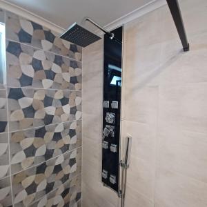 a shower with a glass door in a bathroom at Ponti Bay Apartments in Vasiliki