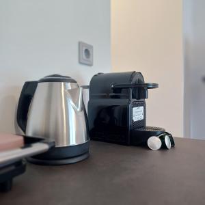 a coffee maker and toaster sitting on a counter at Ponti Bay Apartments in Vasiliki
