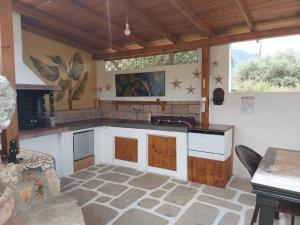 a kitchen with a sink and a counter top at Varias Art House in Kallirákhi
