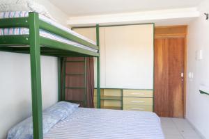 Ένα ή περισσότερα κρεβάτια σε δωμάτιο στο FLAT ACONCHEGANTE