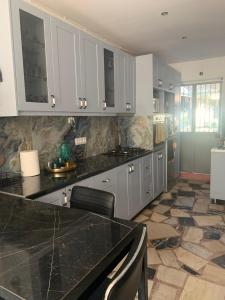 A kitchen or kitchenette at Melinas Maisonette
