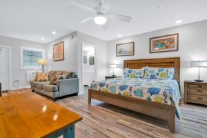 a bedroom with a bed and a couch at Coconut Cay Resort in Marathon