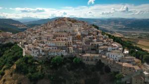 a village on top of a hill in the mountains at A casa di Alberta B&B Relais in Rotondella