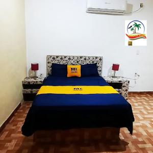 Postel nebo postele na pokoji v ubytování Mi Hotel Club