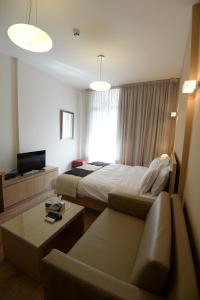 TV a/nebo společenská místnost v ubytování Nest 1 Hotel