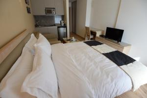 Postel nebo postele na pokoji v ubytování Nest 1 Hotel