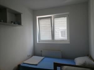 Ένα ή περισσότερα κρεβάτια σε δωμάτιο στο Jagodina 301