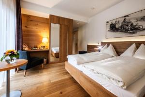 Postel nebo postele na pokoji v ubytování Waldhotel Arosa