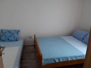 Postel nebo postele na pokoji v ubytování Apartment Karlo