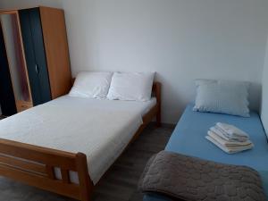 Postel nebo postele na pokoji v ubytování Apartment Karlo