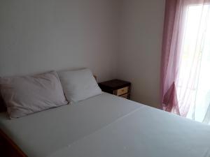Postel nebo postele na pokoji v ubytování Apartment Karlo