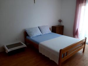 Postel nebo postele na pokoji v ubytování Apartment Karlo