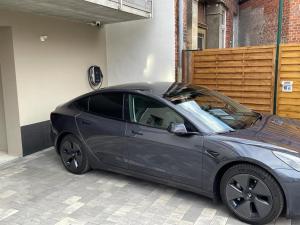 a car parked in a garage with its hood open at Apartmenthaus Seiler in Quedlinburg