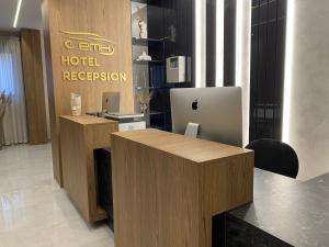 an office with a reception desk with a laptop computer at ELMAR HOTEL in Vlorë