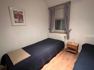 Postel nebo postele na pokoji v ubytování Gorch-Fock-Straße 2