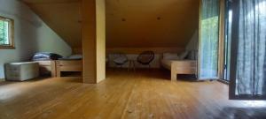 a living room with a couch and a table at Villa on the lake near Mostar in Jablanica