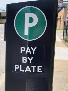 a parking meter with a pay by plate sign on it at The Blue Golden Luxury Modern 3- Bedroom Apartment in Chicago in Chicago