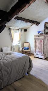 Łóżko lub łóżka w pokoju w obiekcie Un Jardin Secret